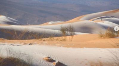 Snowfall on hot sand