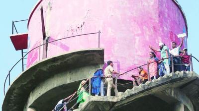 Jobless teachers scale water tank on teachers day