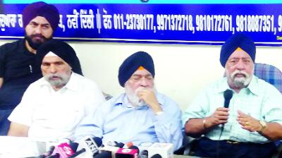Talking to the media, Paramjit Singh Sarna and Harvinder Singh Sarna
