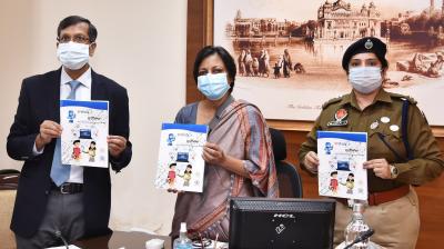 Punjab Chief Secretary Vini Mahajan releasing a booklet on cyber security at Chandigarh in the presence of DGP Dinkar Gupta during online launch of state level ‘Cyber Surakhya’ campaign in Punjab at Chandigarh on Friday November 20, 2020.