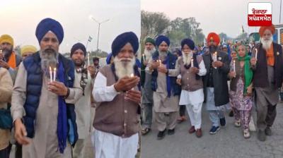 ਸ਼ੰਭੂ ਬਾਰਡਰ ’ਤੇ ਕਿਸਾਨ ਸ਼ਹੀਦ ਸ਼ੁਭਕਰਨ ਸਿੰਘ ਦੀ ਬਰਸੀ ’ਤੇ ਕੈਂਡਲ ਮਾਰਚ ਕੱਢਦੇ ਹੋਏ 