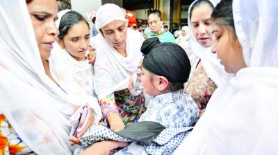 Relatives while crying for Dead Sikh Peoples