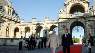 Emmanuel macron shows pm narendra modi france famous historic building 