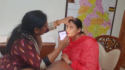 Dr. Baljit Kaur examined eyes of Hargobind Kaur,  President of Anganwadi Union