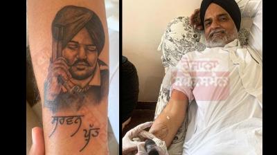 Late singer Sidhu Moosewala's father made a tattoo of his son on his arm