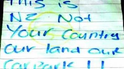 Racial threat to café owner