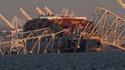 The bridge collapsed due to the collision of the cargo ship in Baltimore