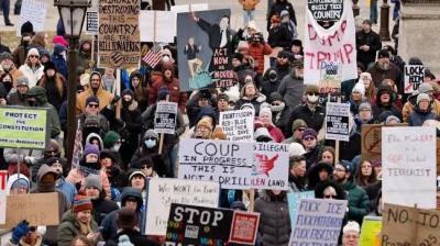 ਪ੍ਰਦਰਸ਼ਨਕਾਰੀ ਕਰ ਰਹੇ ਪ੍ਰਵਾਸੀ