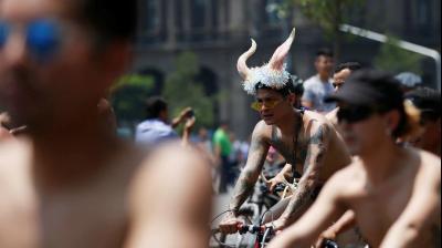 Naked cyclist ride in Mexico demands street safety