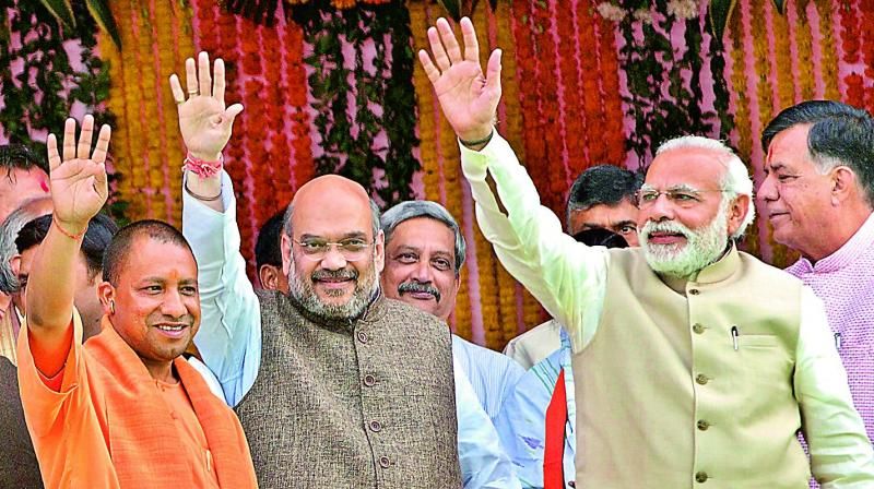 yogi with amit shah and modi 