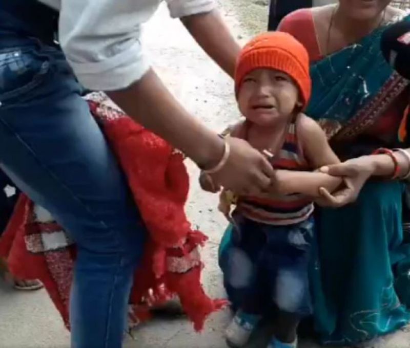 Assam police remove 3 years old child jacket 