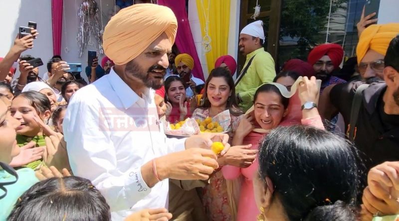 Balkaur Singh distributed laddus and put bhangra Balkaur Singh distributed laddus and put bhangra