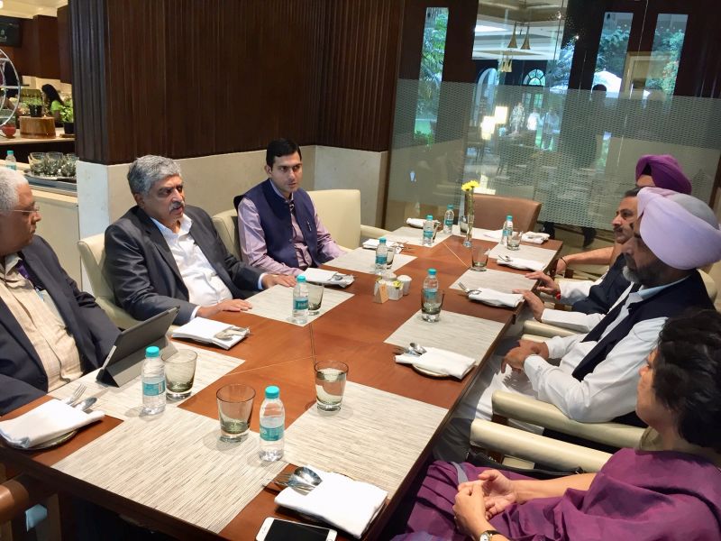 Manpreet Singh Badal and Vijay Inder Singla deliberating with the Co-founder of Infosys Nandan Nilekani