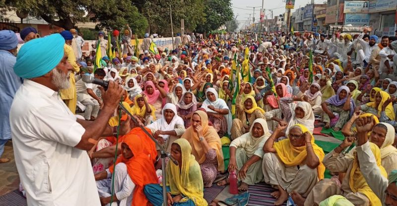 Flags of Kisan Unions in the hands of old women and children