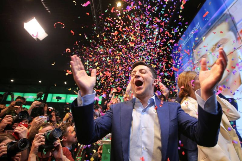 Ukrainian presidential candidate Volodymyr Zelenskiy reacts following the announcement of the first exit poll