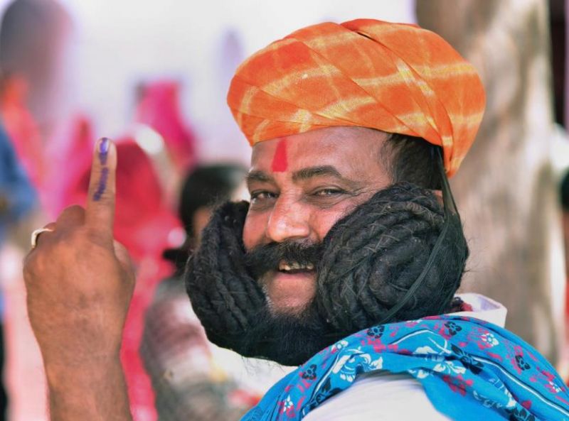 Girdhar Vyas, who claims to have the world's longest moustache, voted today in Rajasthan's Bikaner