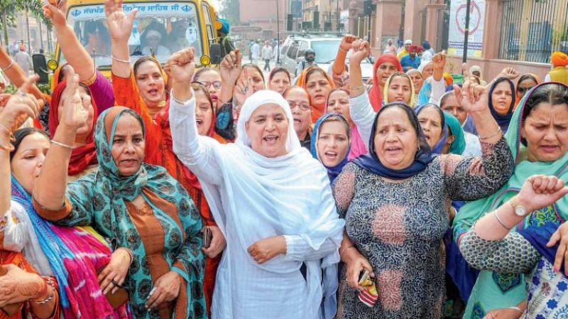 Shiromani Akali Dal members stage a protest rally demanding justice for the families of those killed in the 1984 anti-Sikh riots