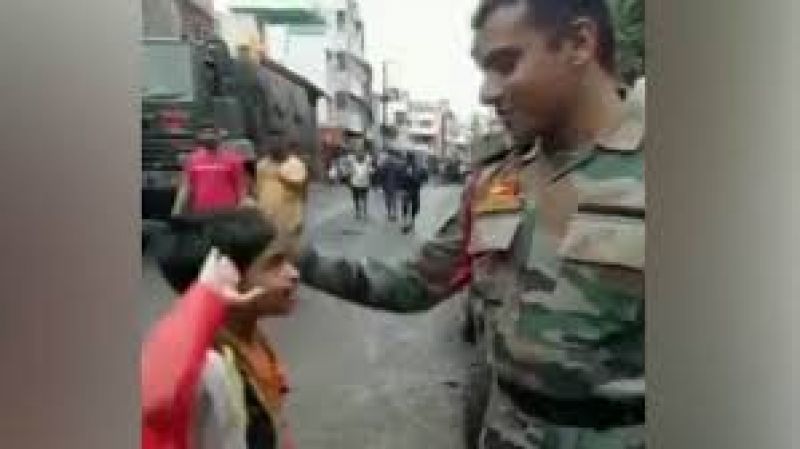 Child salutes an army personnel