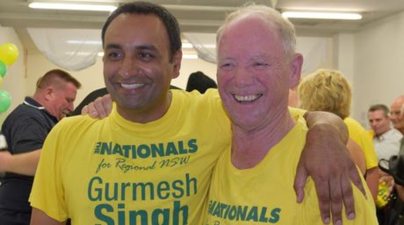 Retiring Member for Coffs Harbour Andrew Fraser hands over the baton to Nationals candidate Gurmesh Singh after 28 years in office.