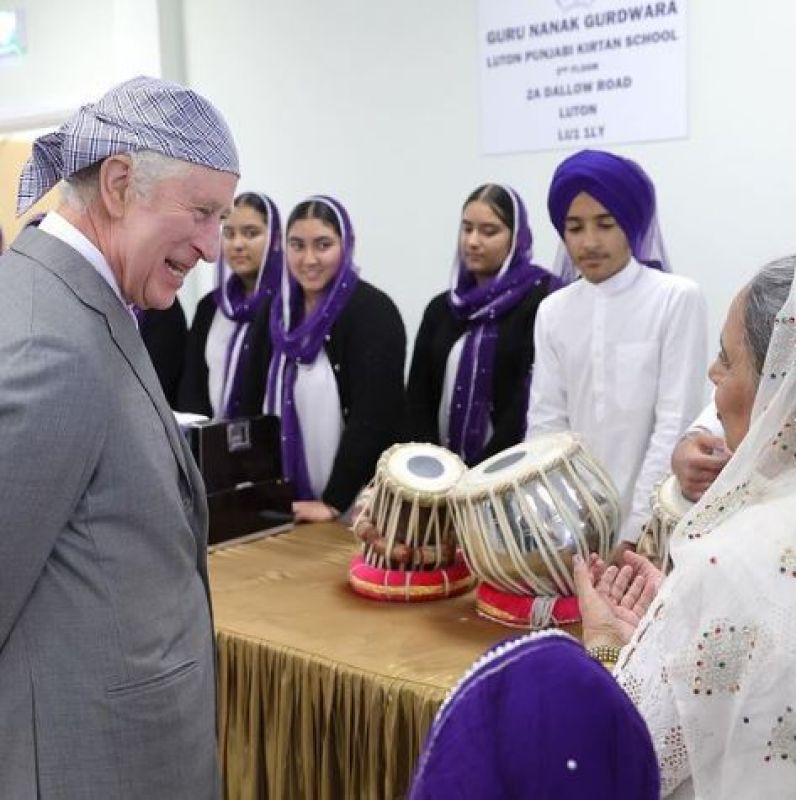 KIng Charles ask the students about instruments they were playing