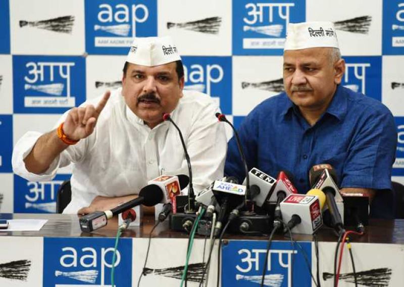 AAP leader Manish Sisodia along with MP Sanjay Singh addresses the media at the party office in New Delhi.