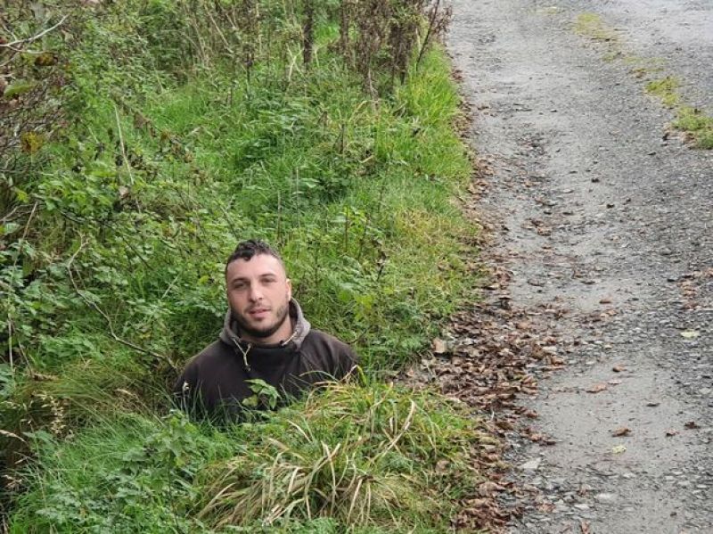 Fed-up motorist got his son to stand in pothole to show how huge it is