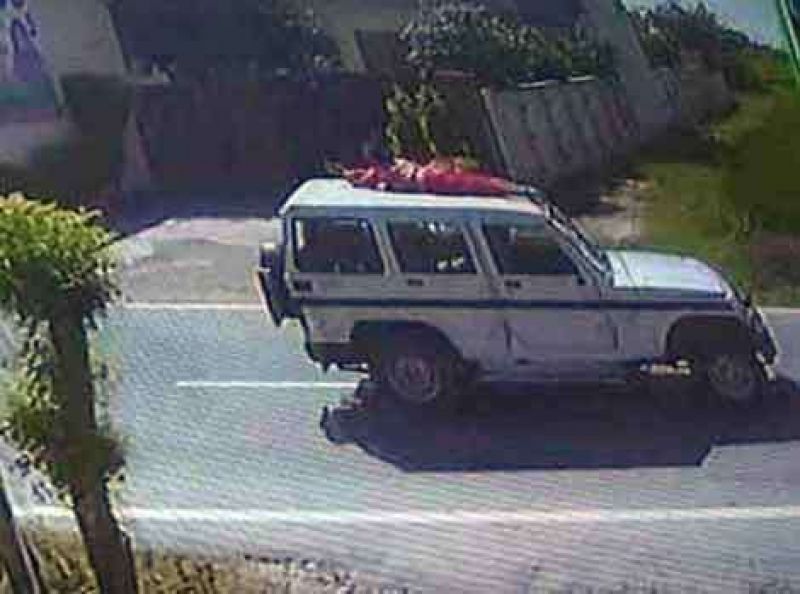 Forced Woman to sit on top of police jeep