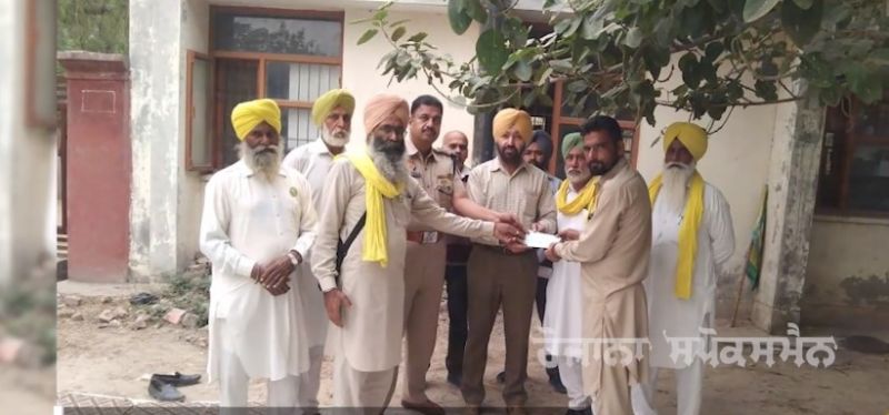 Checks distributed to the families of martyred women at Tikri border
