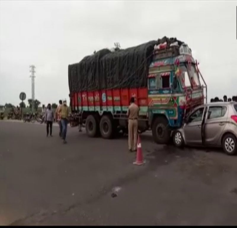 Heavy truck collided between car and truck