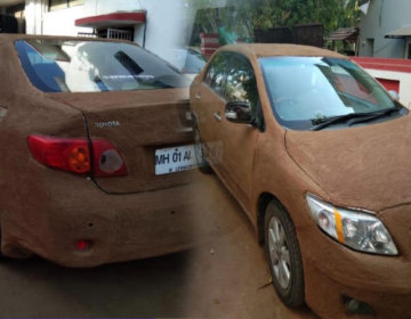 pune senior doctor coats his car with cow dung to beat heat