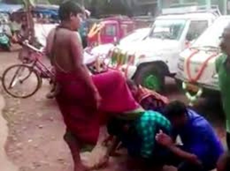 priest blessing by foot