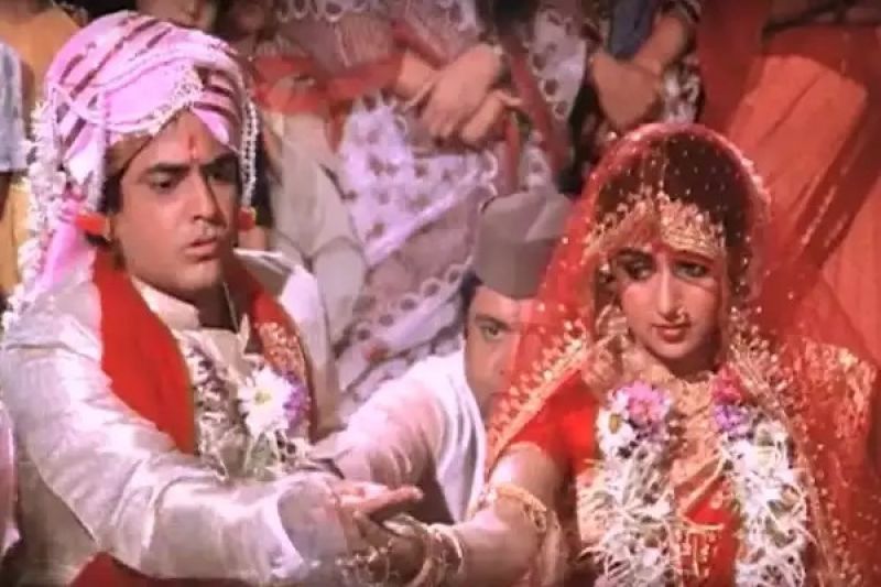 Jeetendra with Hema Malini in a movie scene 