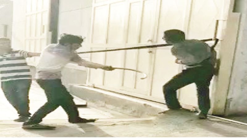 People beating Dalit