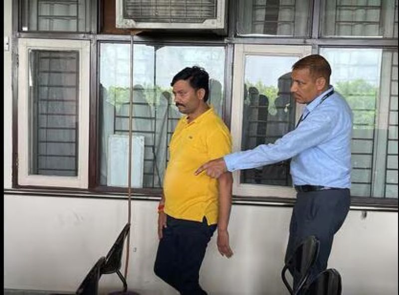 Manish Dubey before being presented before a court in Chandigarh