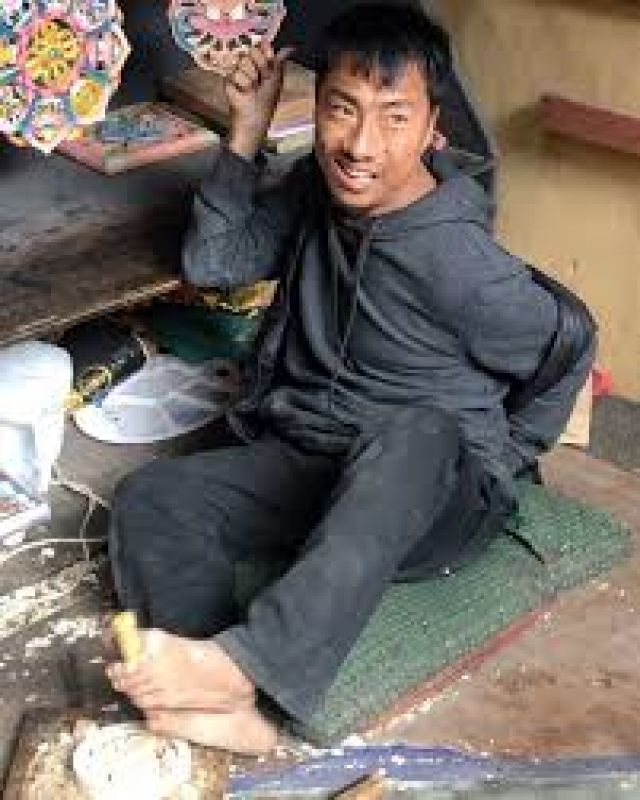 Handicapped person painted his artwork