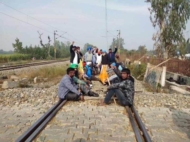 Farmers on railway track