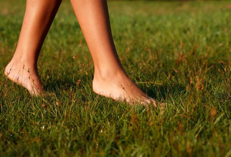  Walking barefoot on green grass eliminates many problems